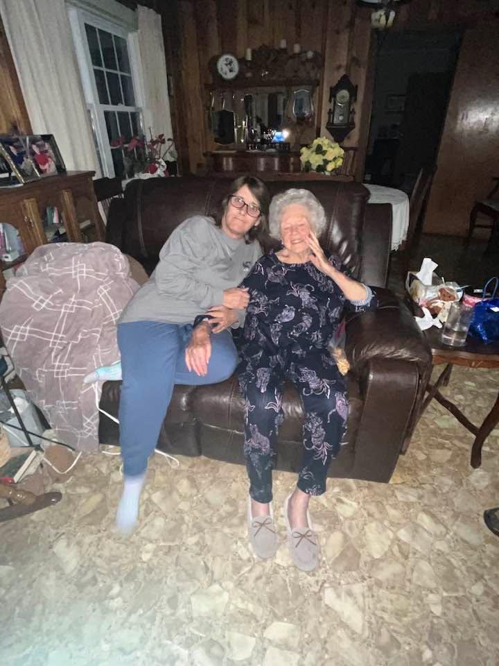 Two women sitting on a couch