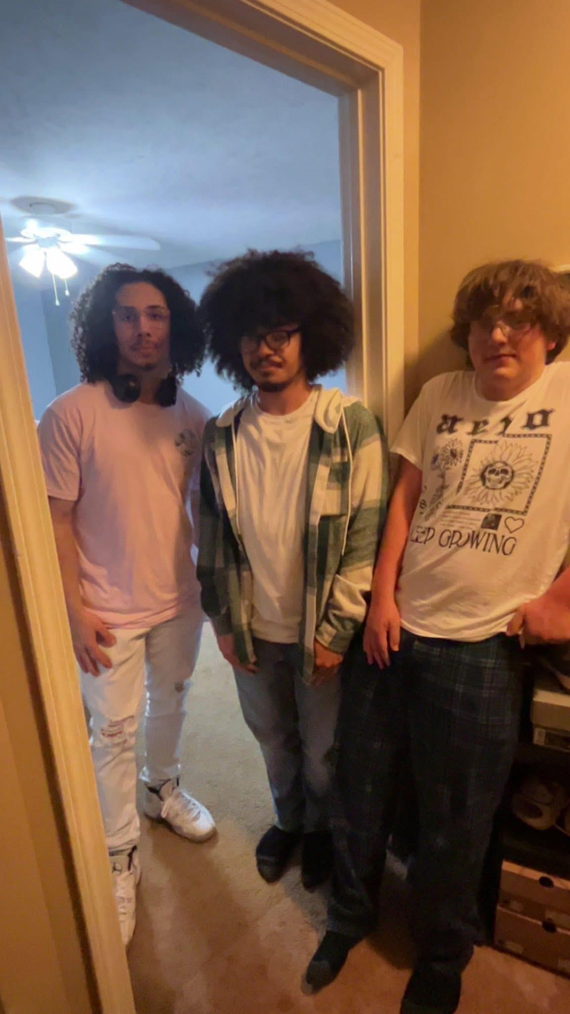A group of men standing in a doorway