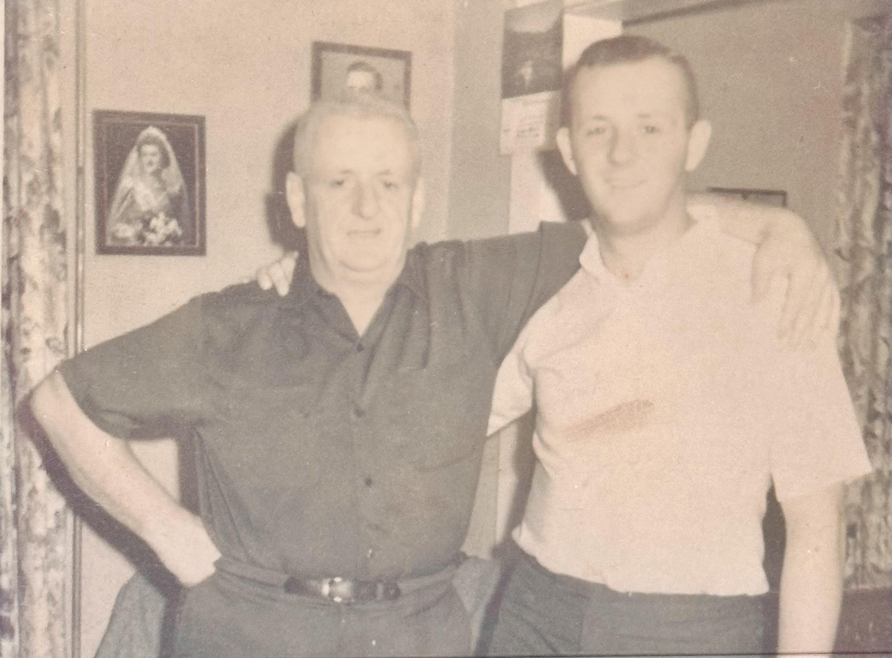 A man with his arms around another man