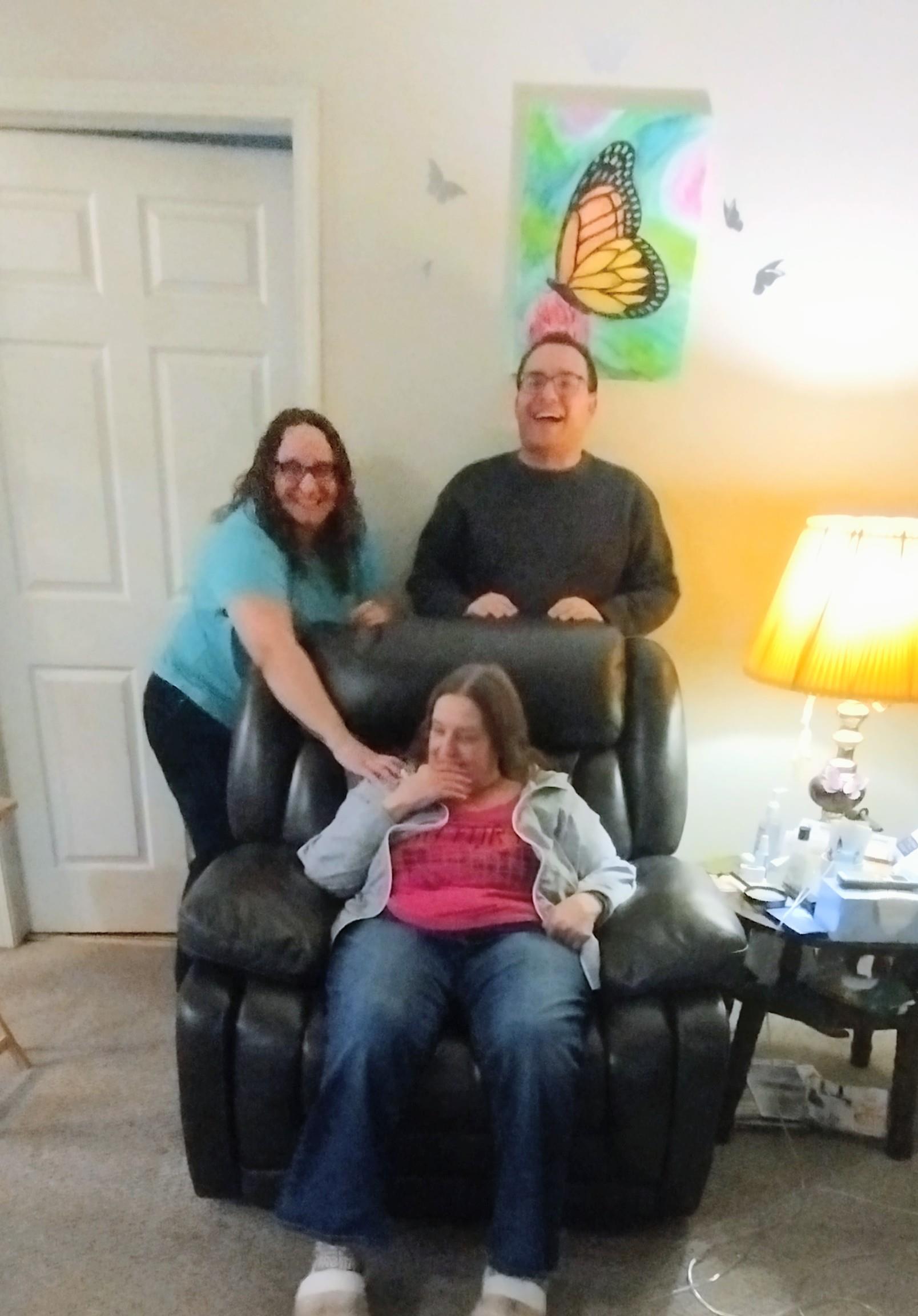 A group of people standing in a chair