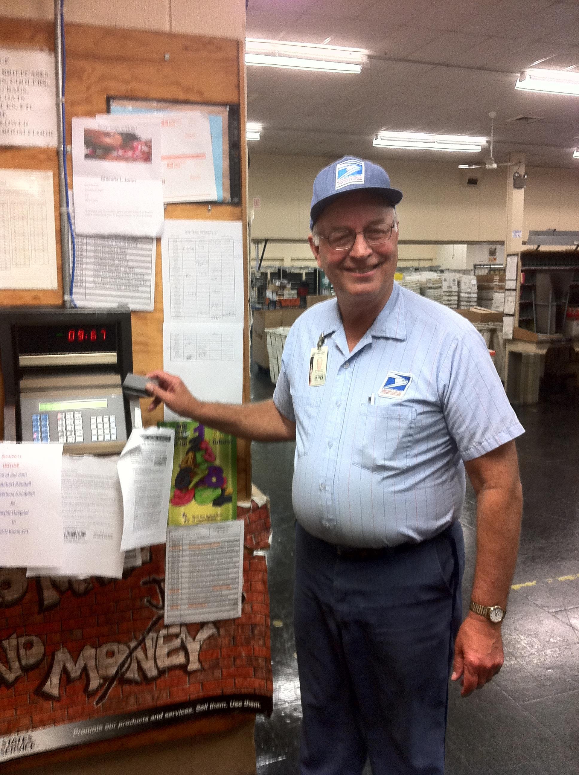A man standing next to a machine