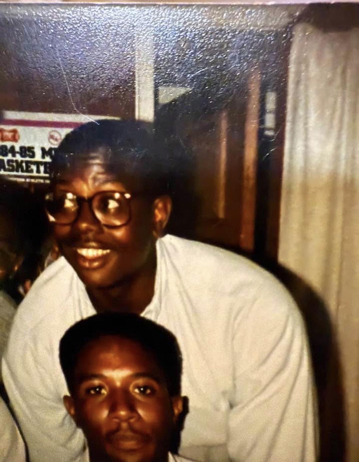 A man and boy posing for a picture