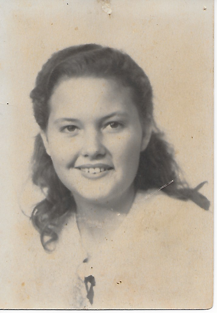 A woman with long hair smiling
