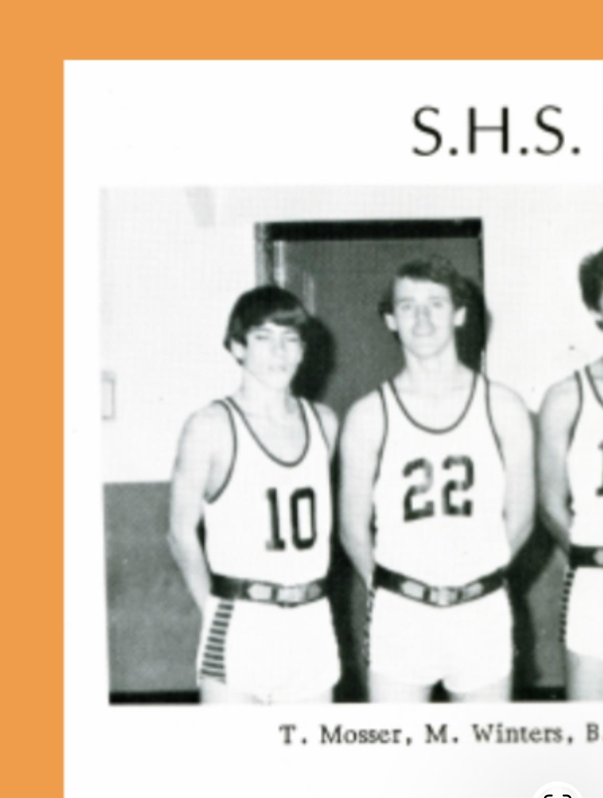 A group of men in basketball uniforms