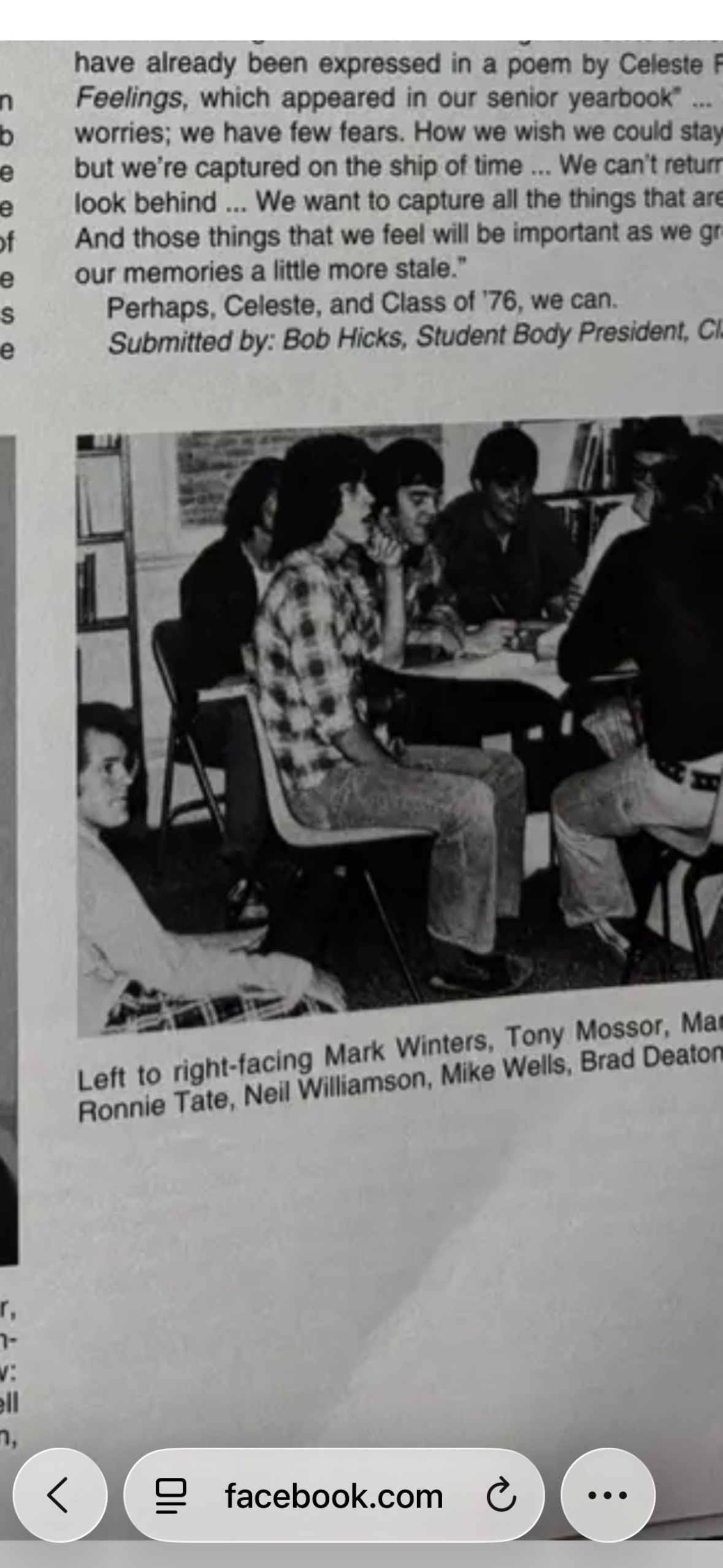 A group of people sitting at a desk