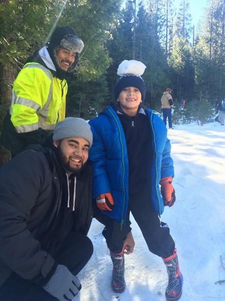 A group of people posing for a picture in the snow