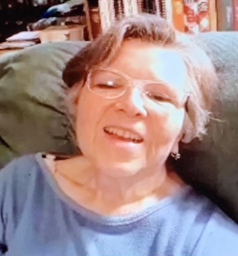 A woman smiling at camera