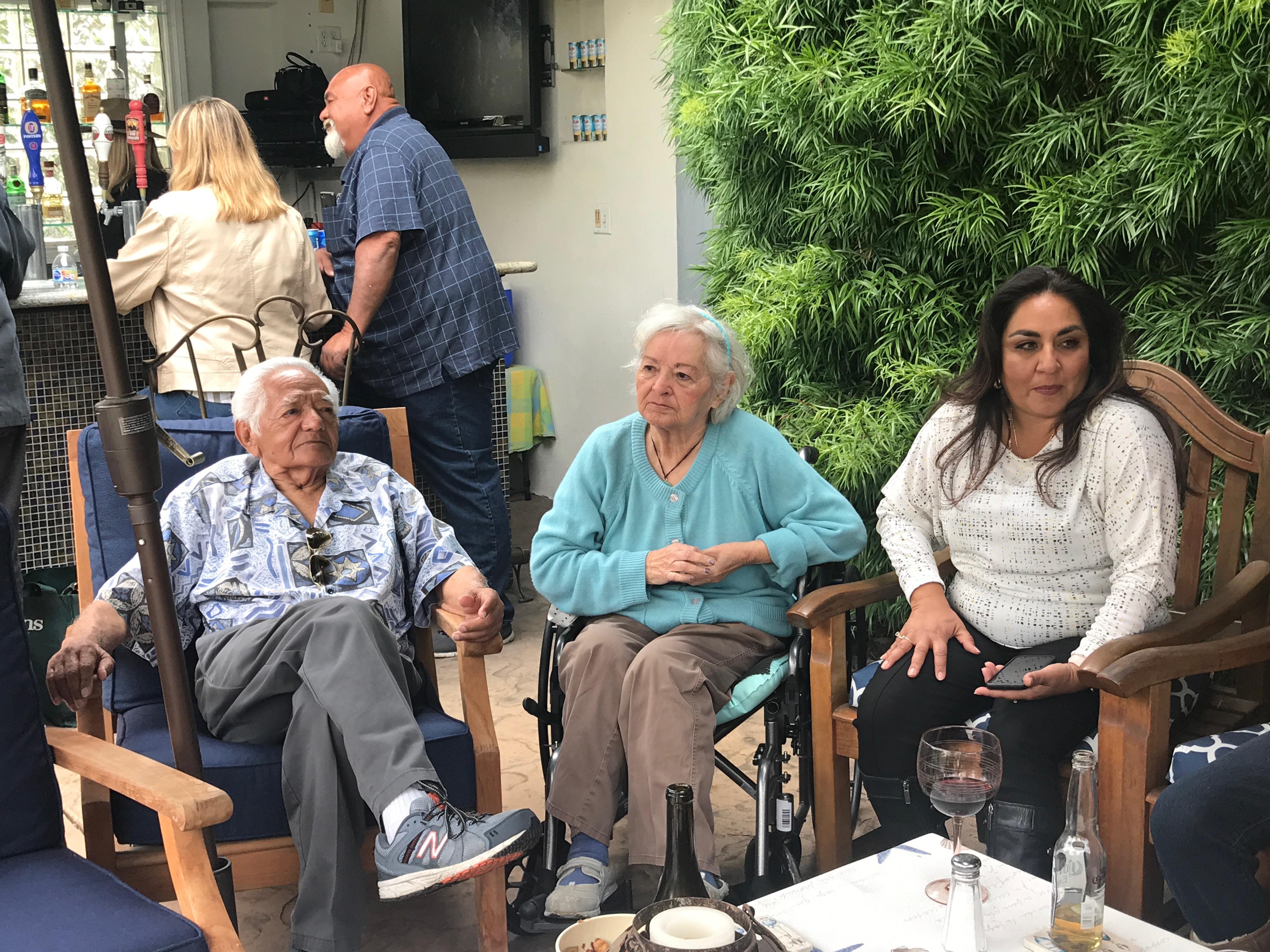 A group of people sitting in chairs