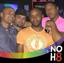 A group of men posing for a photo