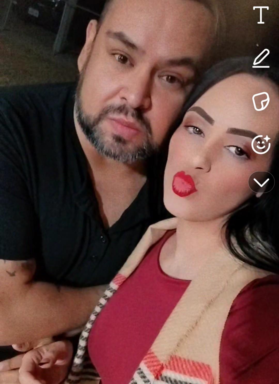 A man and woman taking a selfie