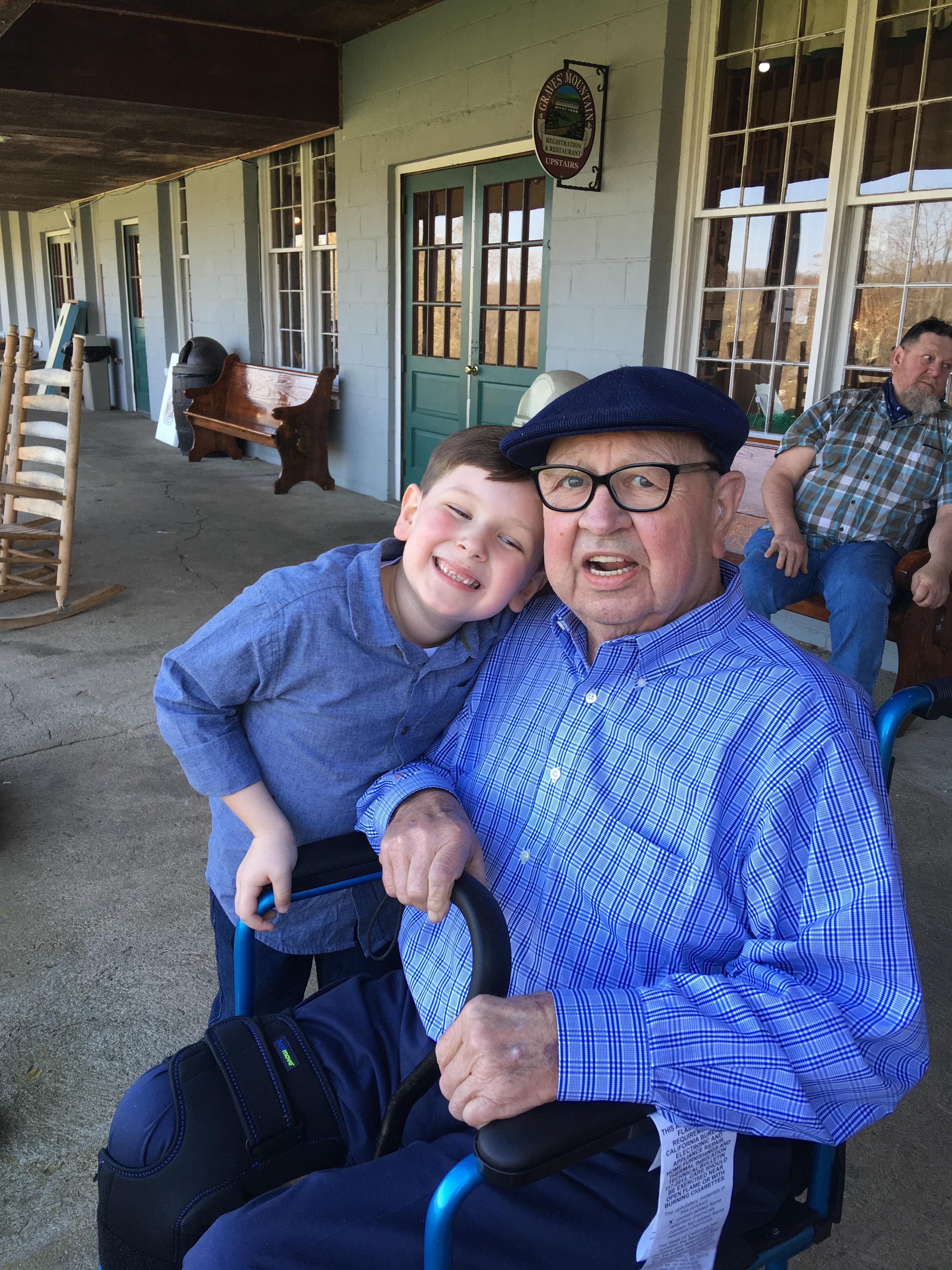 A man and boy posing for a picture