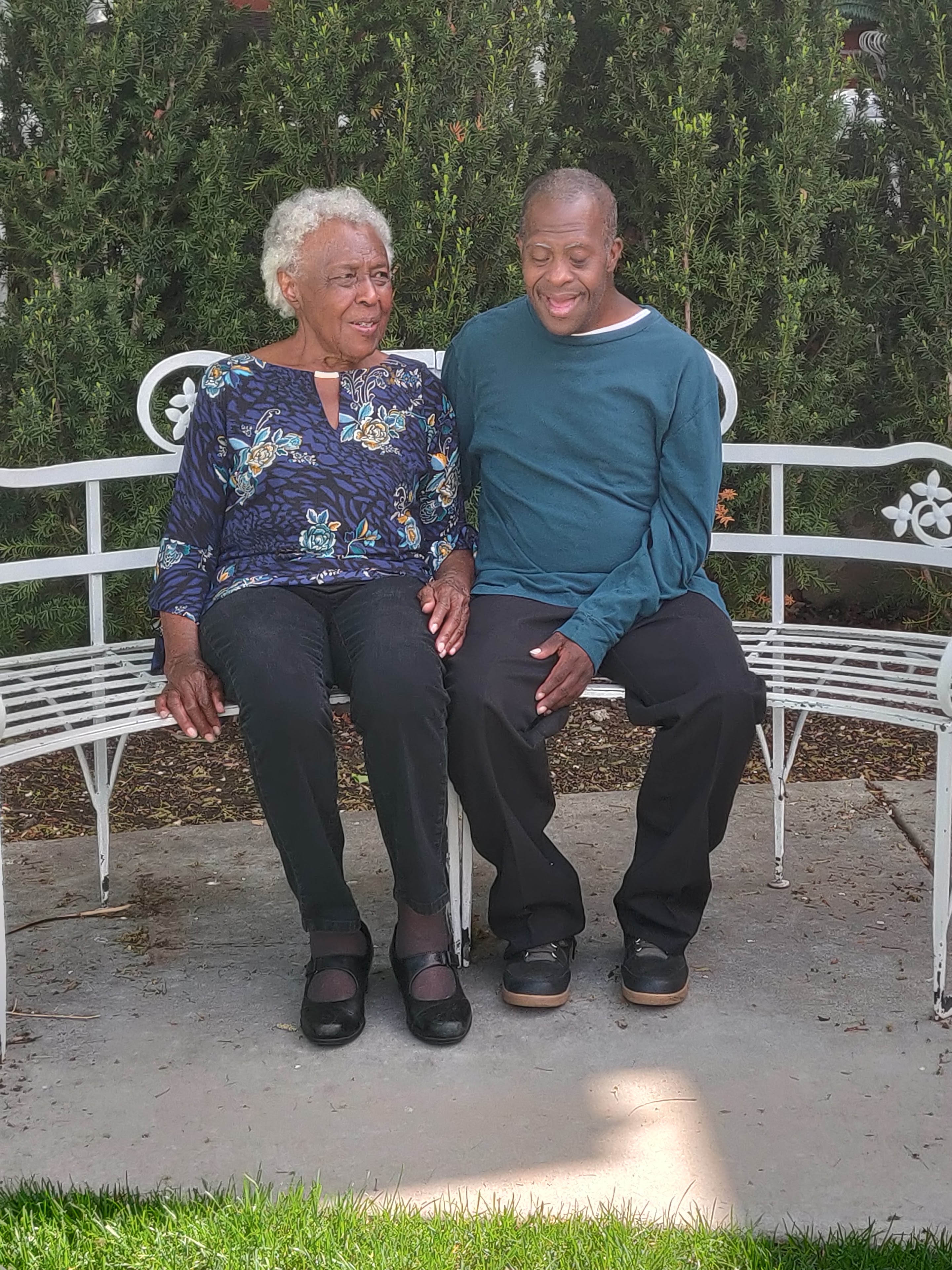 A man and woman sitting on a bench