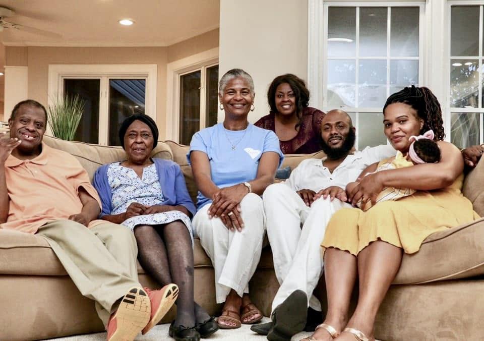 A group of people sitting on a couch