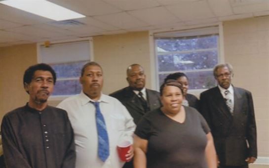 A group of people standing in a room