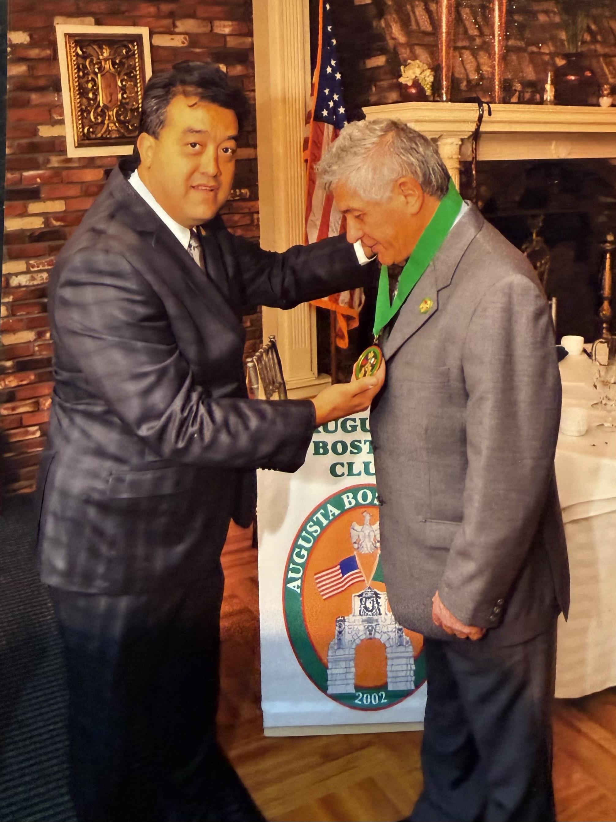 Two men standing next to each other