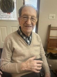 An old man wearing glasses