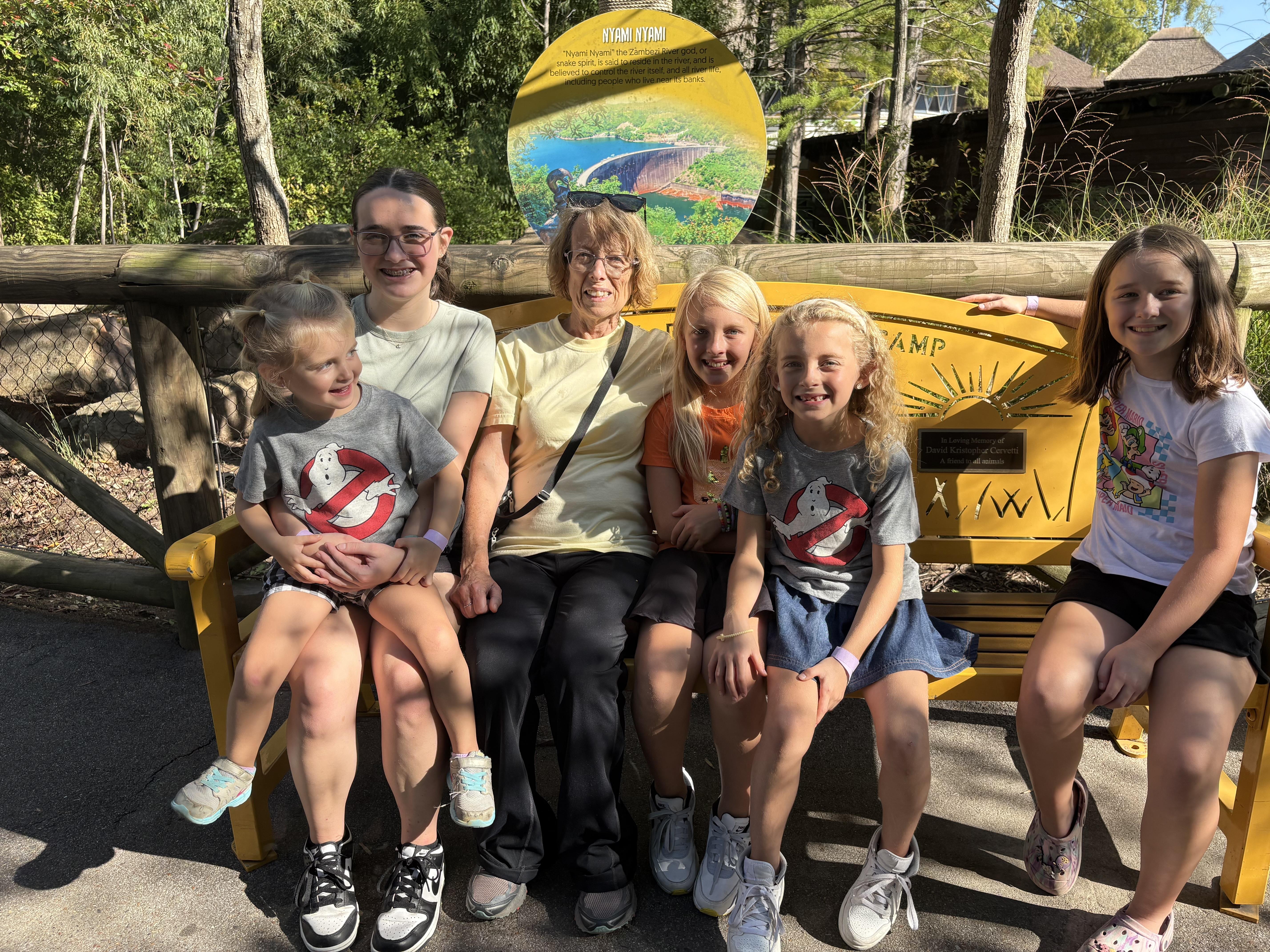 A group of people sitting on a bench