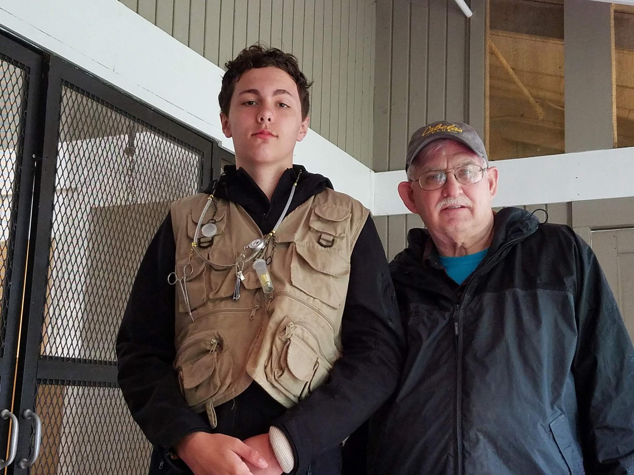 A man and boy standing together
