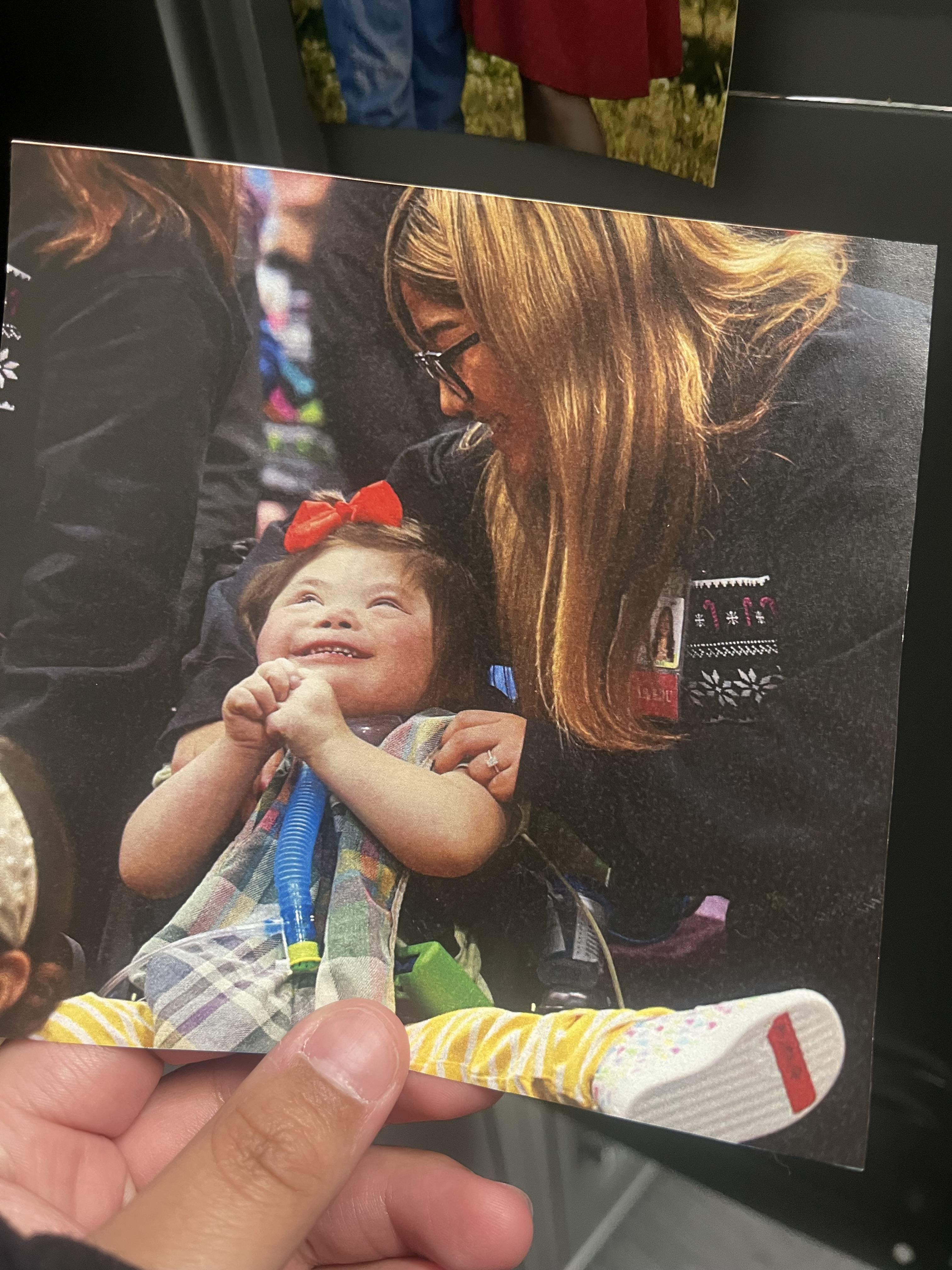 A woman holding a baby