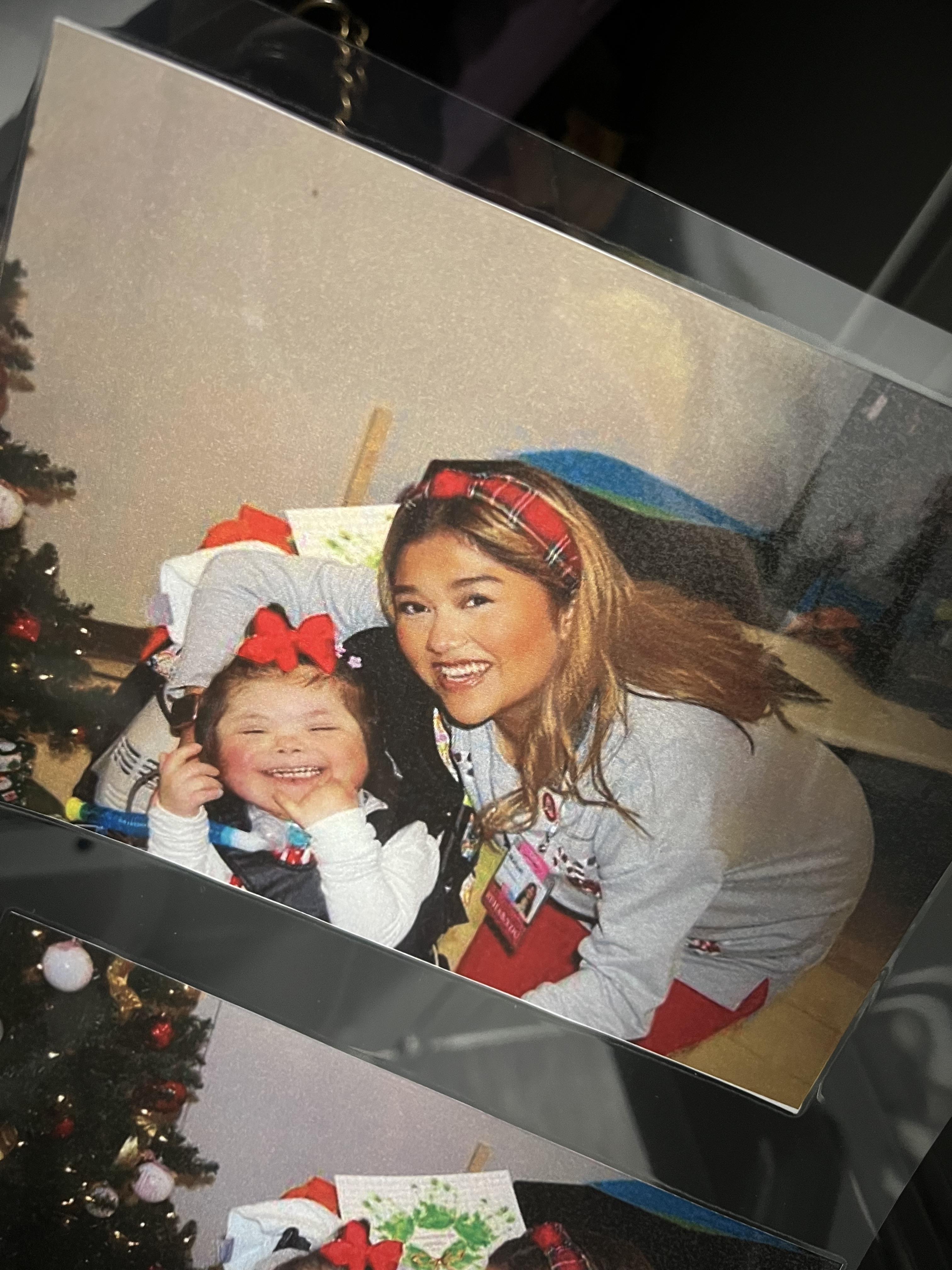 A woman and a child posing for a picture