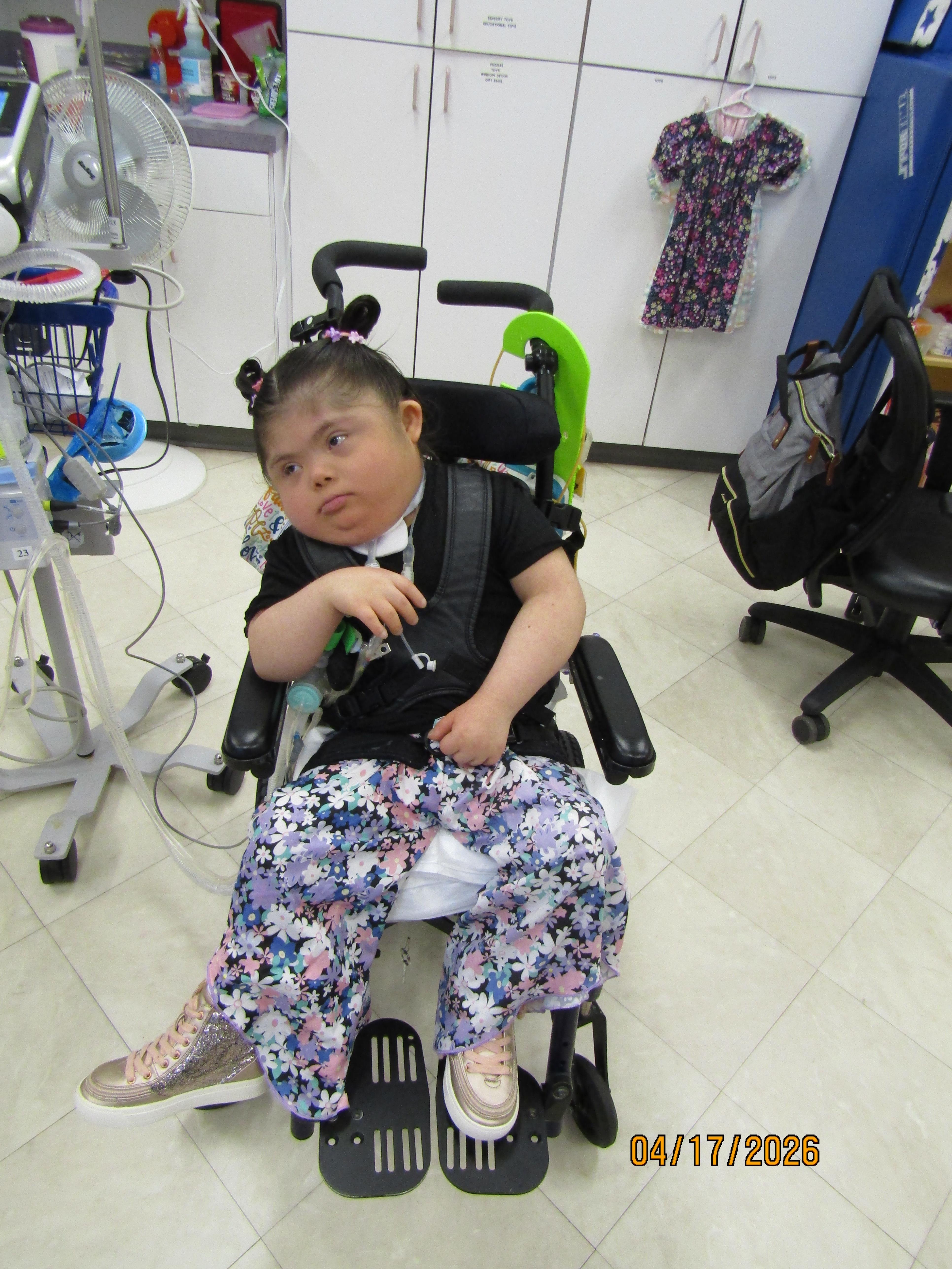 A girl in a wheelchair