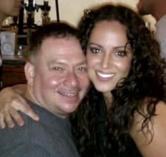 A man and woman smiling for a picture