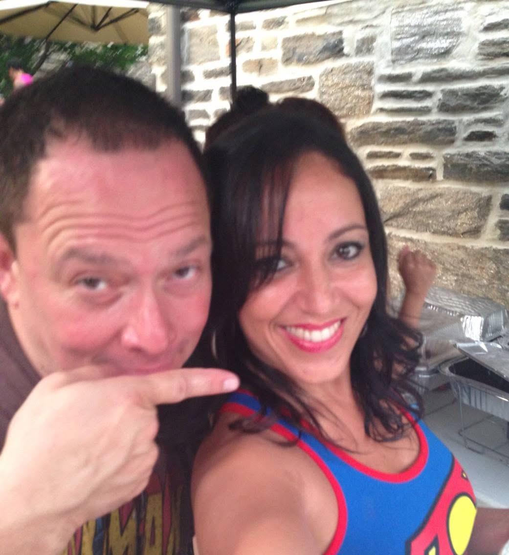 A man and woman posing for a selfie