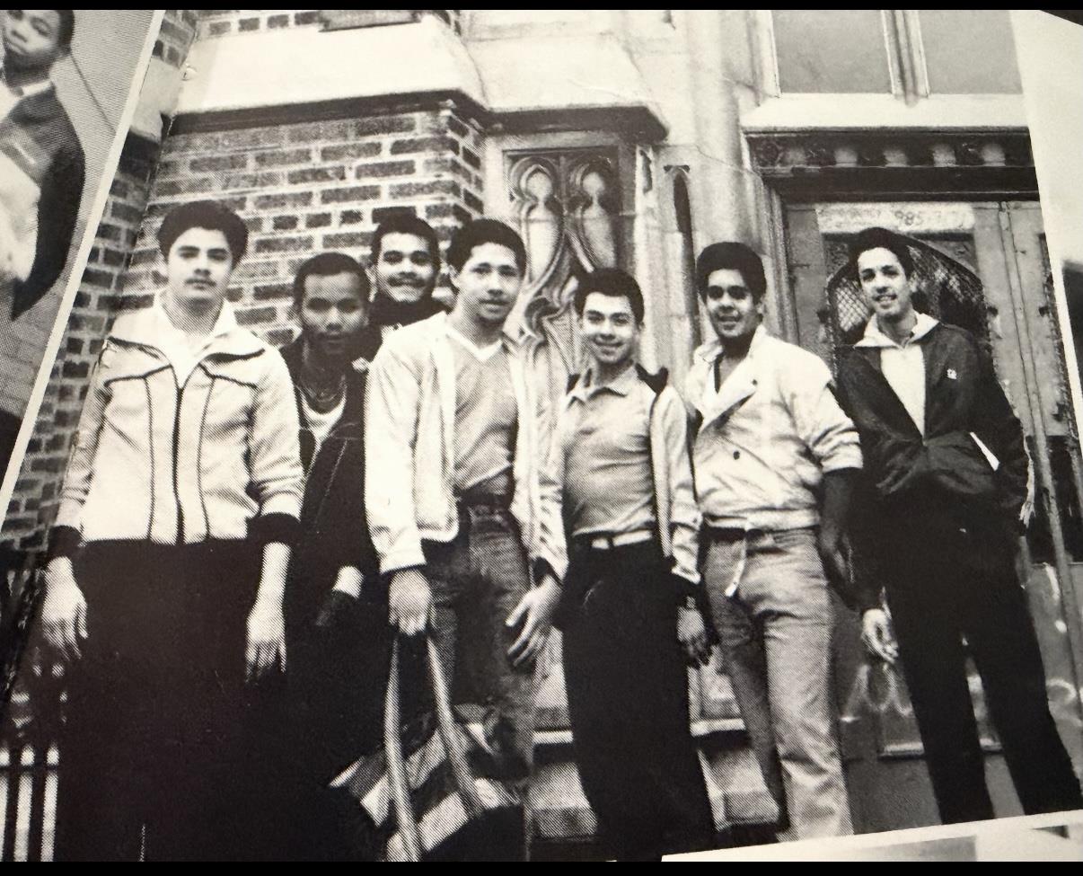 A group of men standing outside a building
