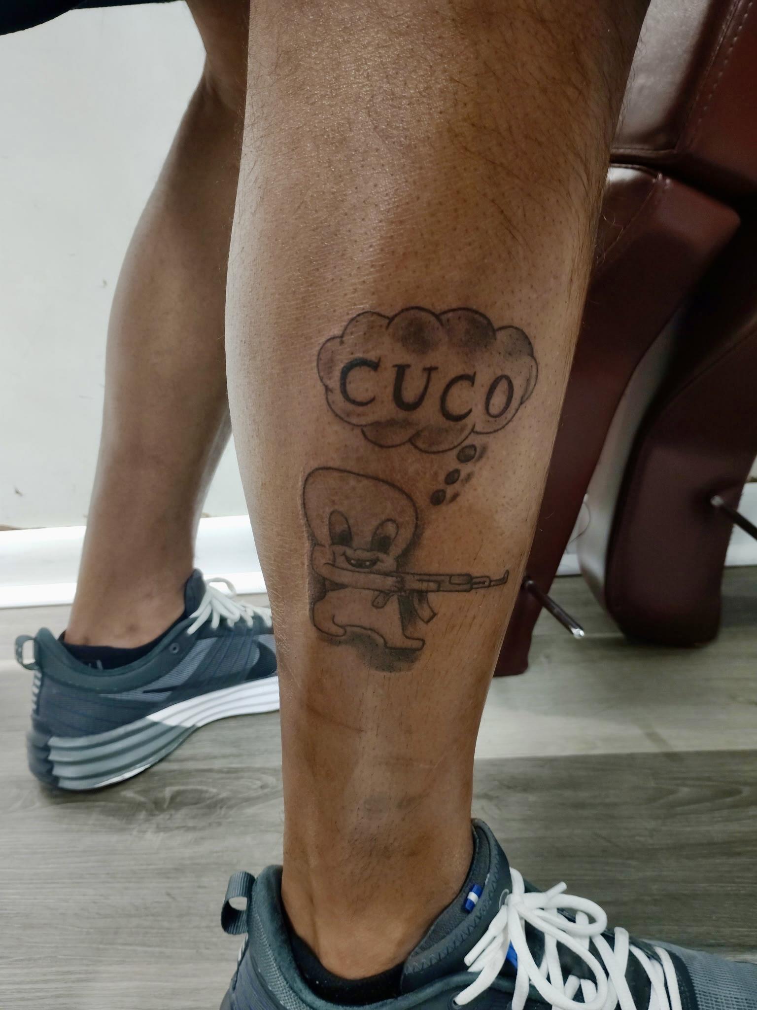 A leg with a tattoo on it
