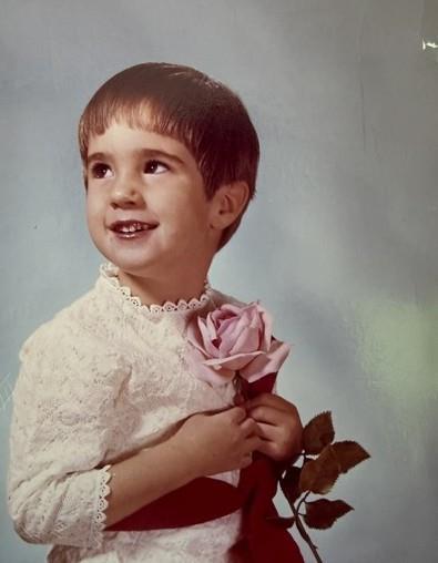 A child holding a rose