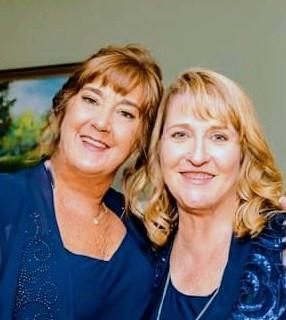 Two women smiling at the camera
