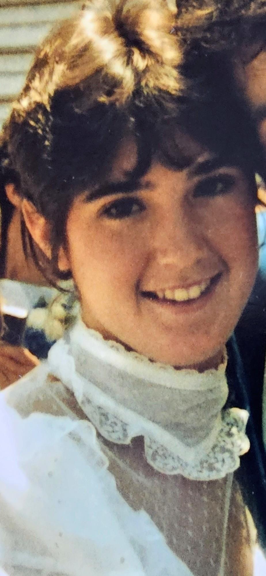 A woman smiling at the camera