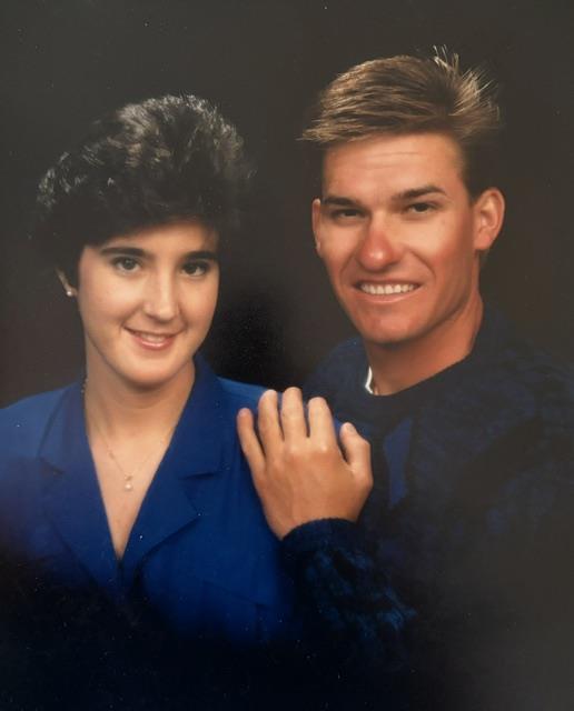 A man and woman posing for a picture