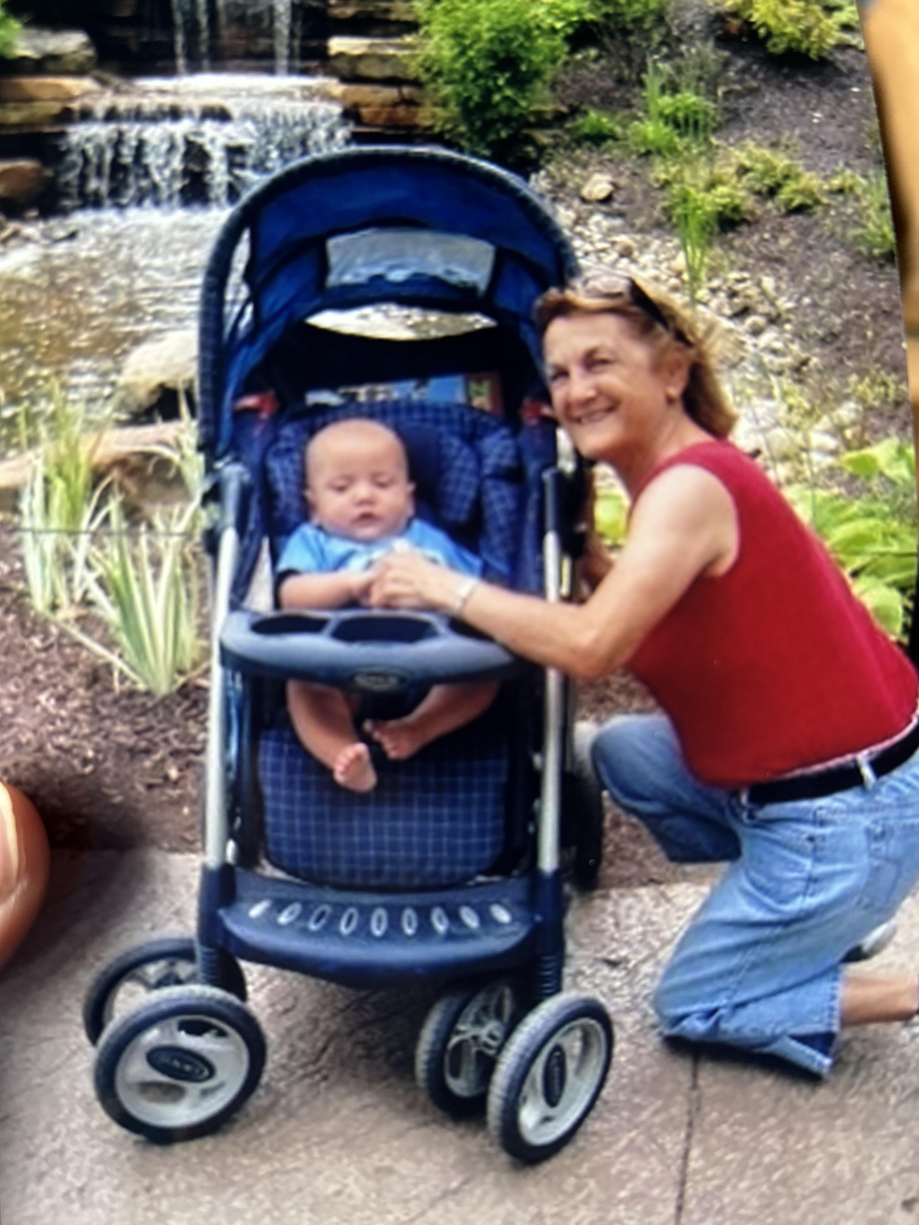A woman pushing a baby in a stroller