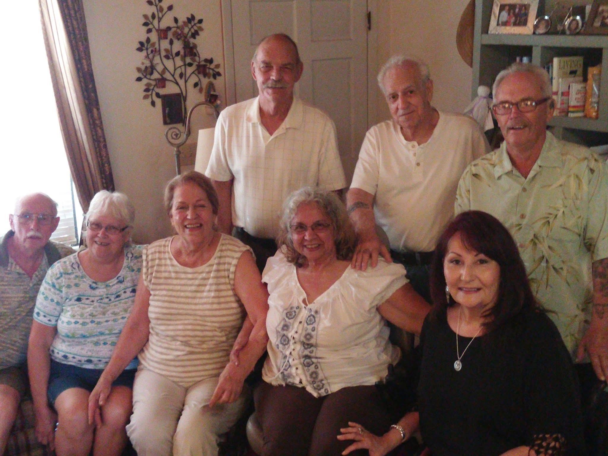 A group of older people posing for a photo
