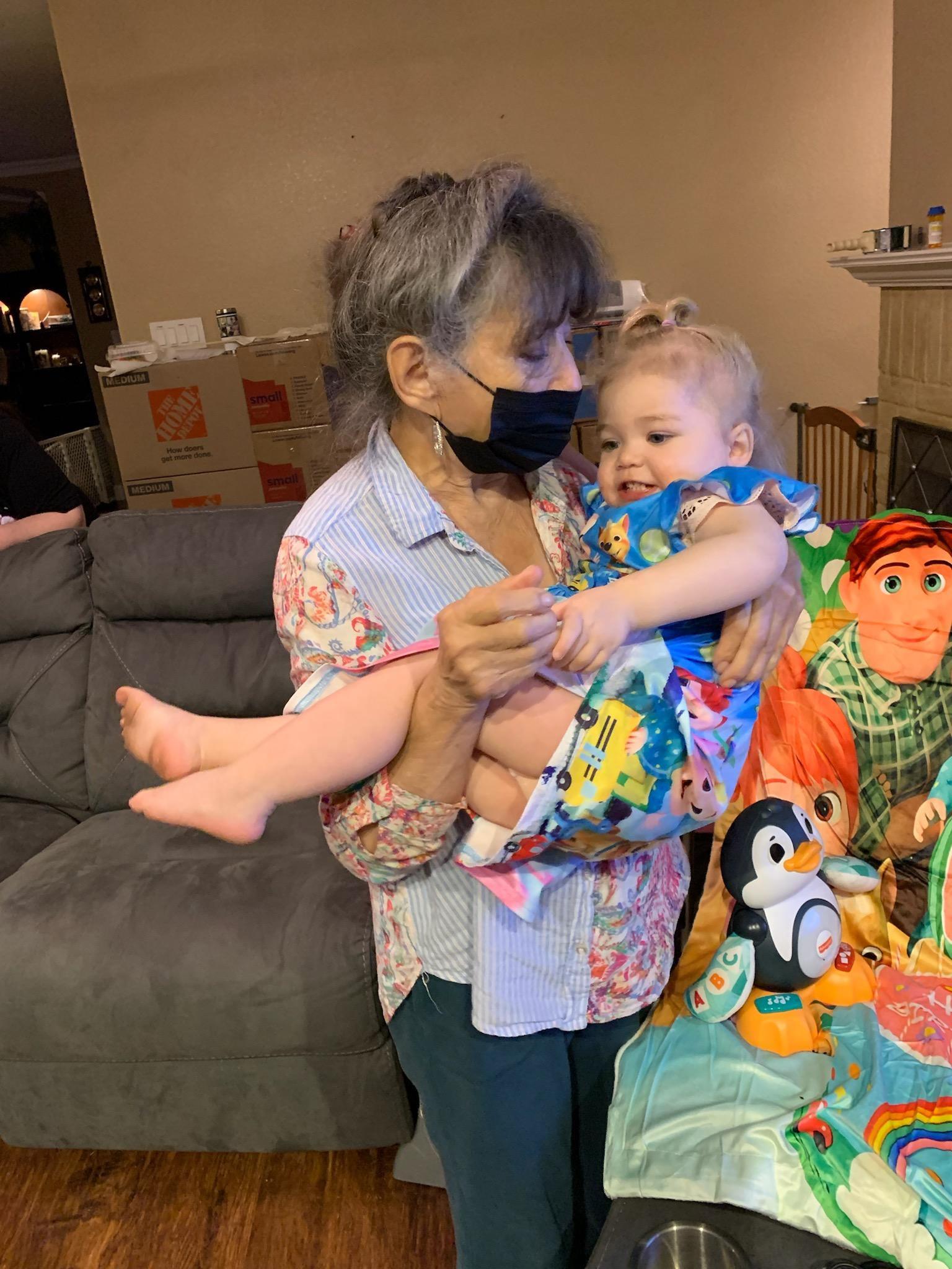 A woman holding a baby