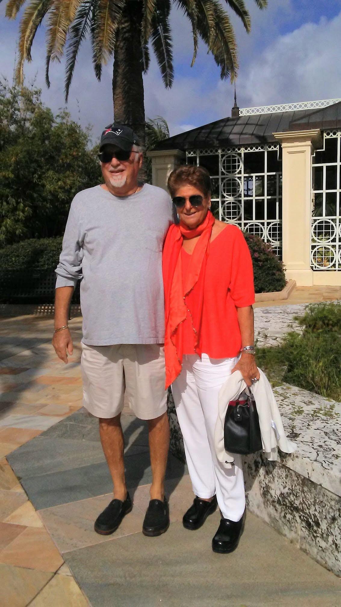 A man and woman standing together outside