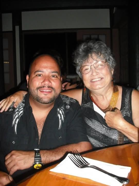 A man and woman posing for a picture