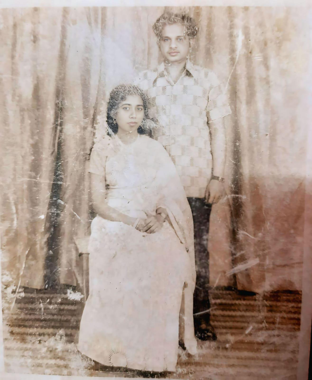 A man and woman posing for a picture