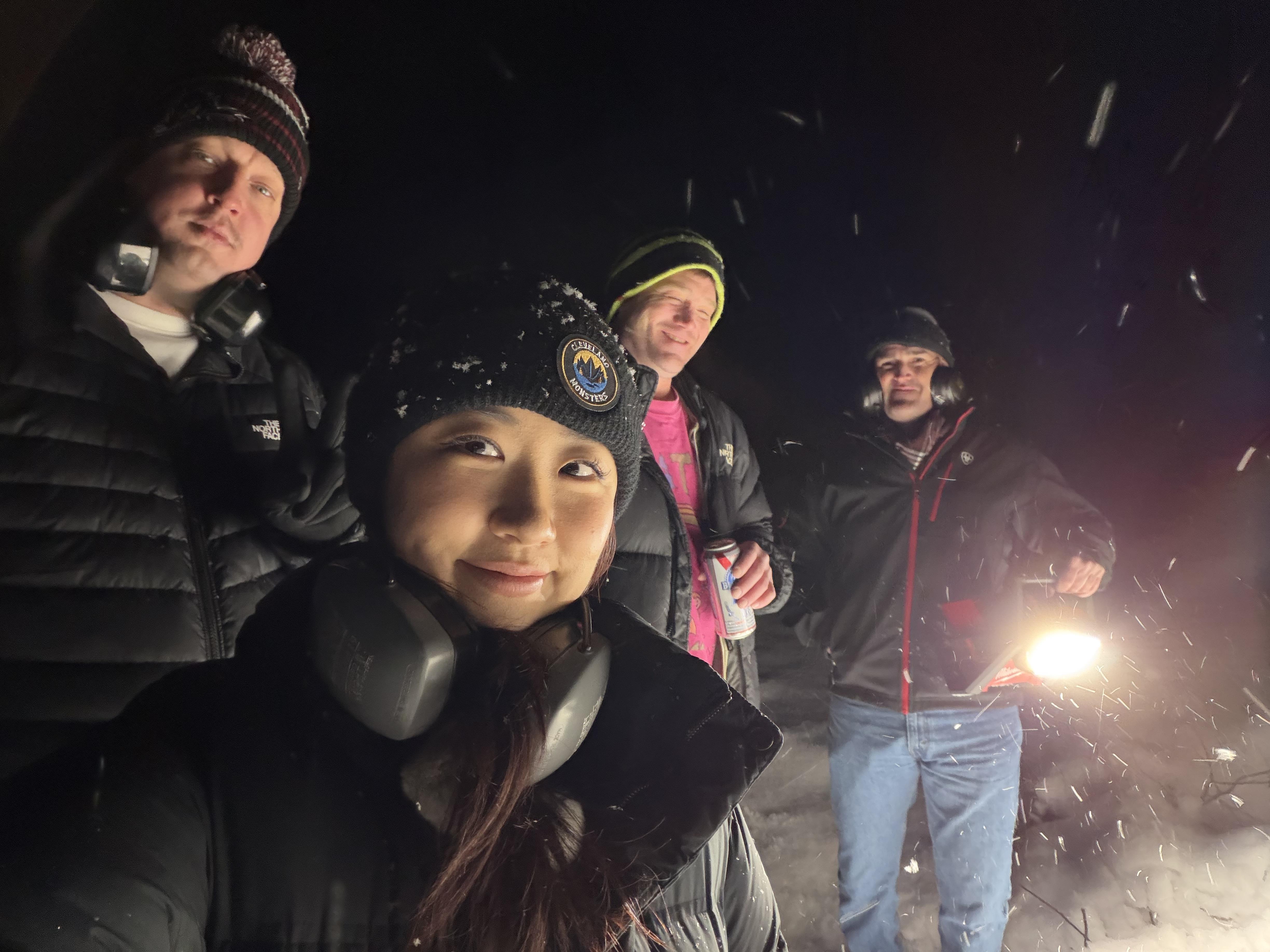 A group of people standing in the snow