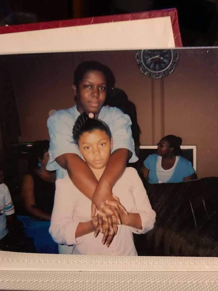 A woman holding a girl