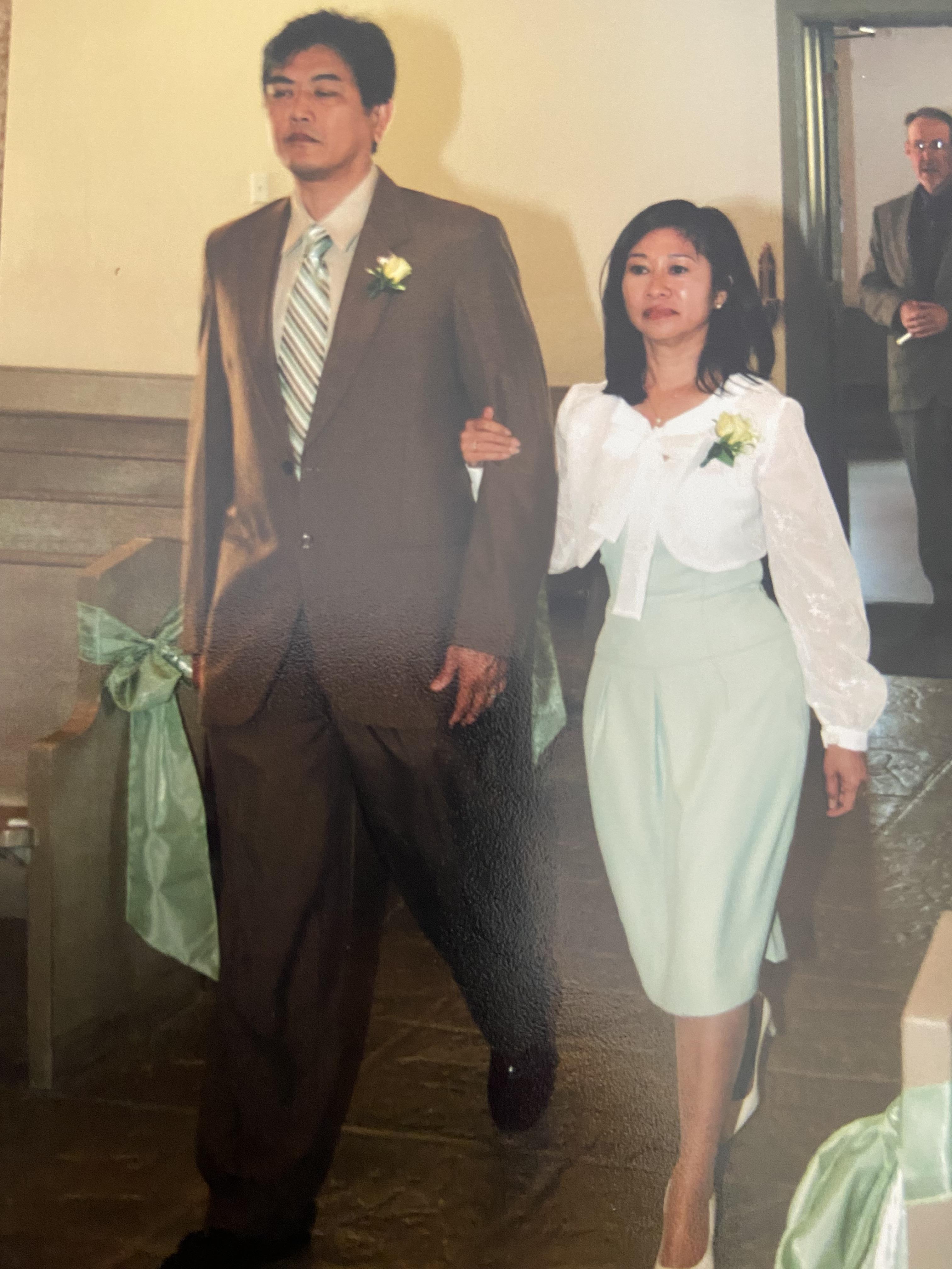 A man and woman walking down a aisle
