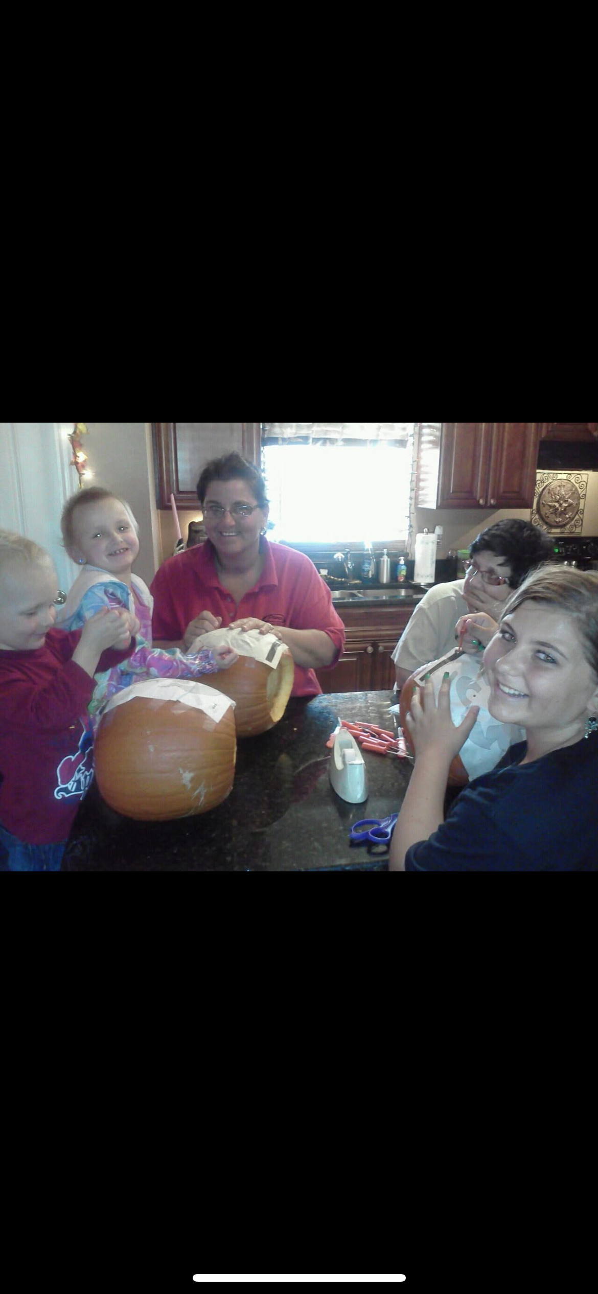 A group of people carving pumpkins