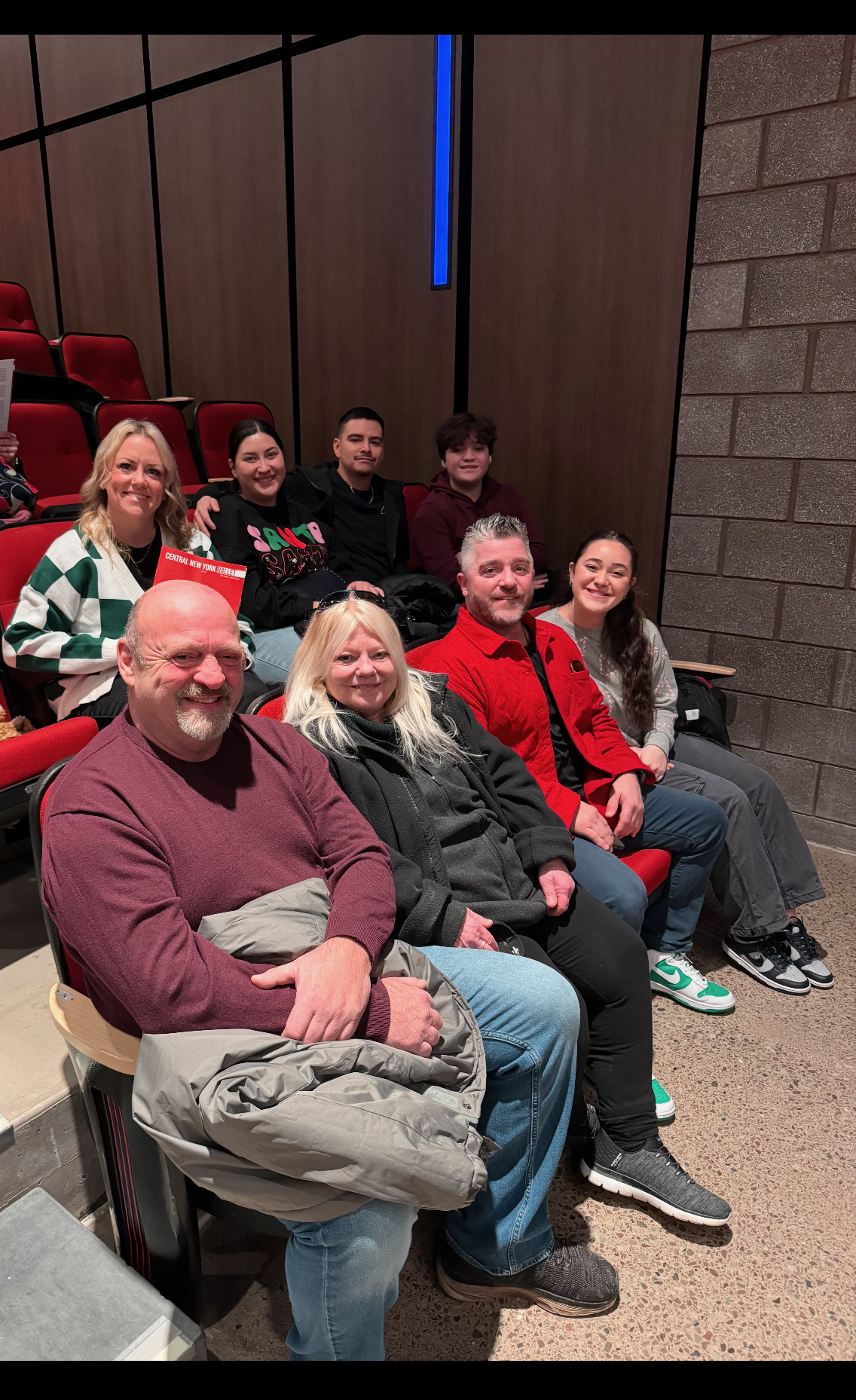 A group of people sitting in chairs