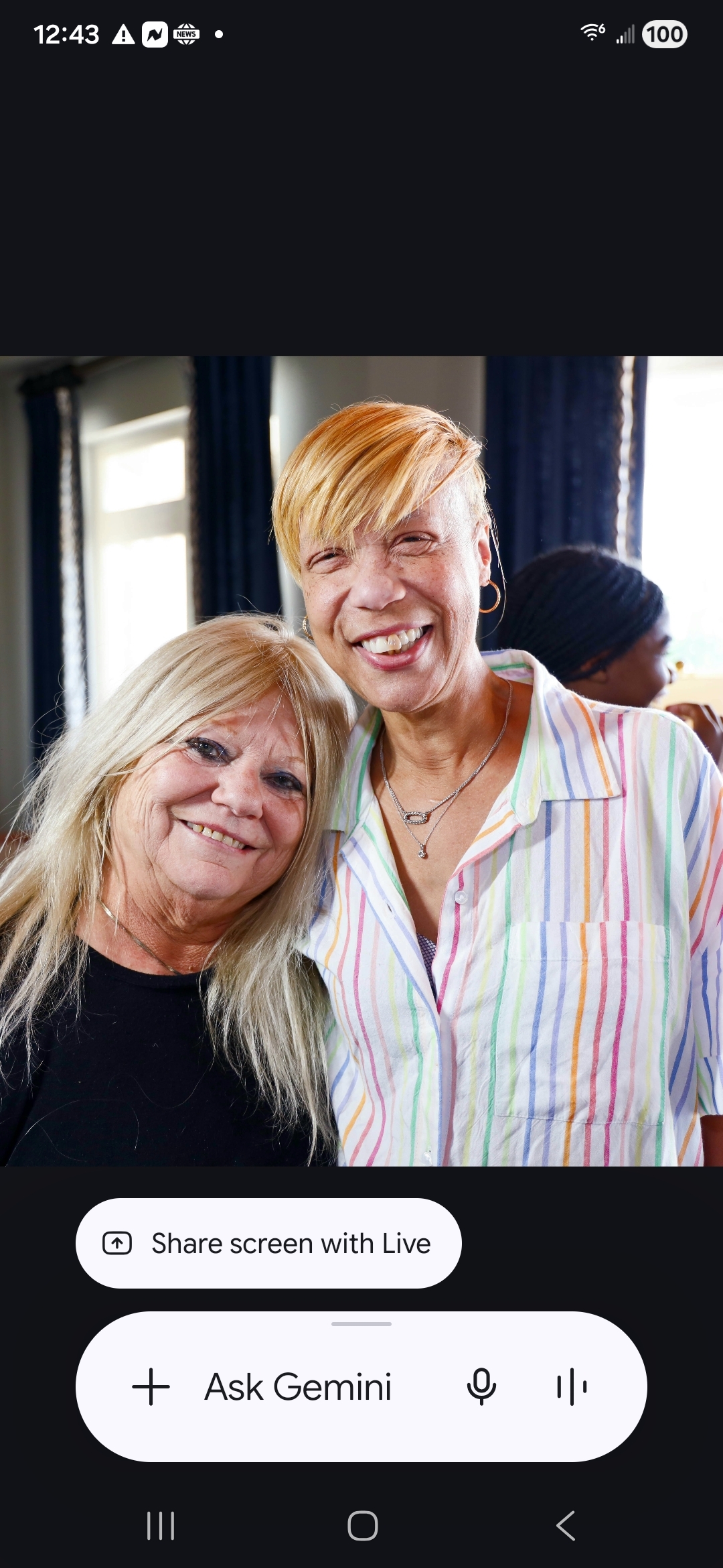 Two women smiling at the camera