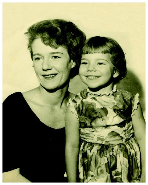 A woman and a child posing for a picture