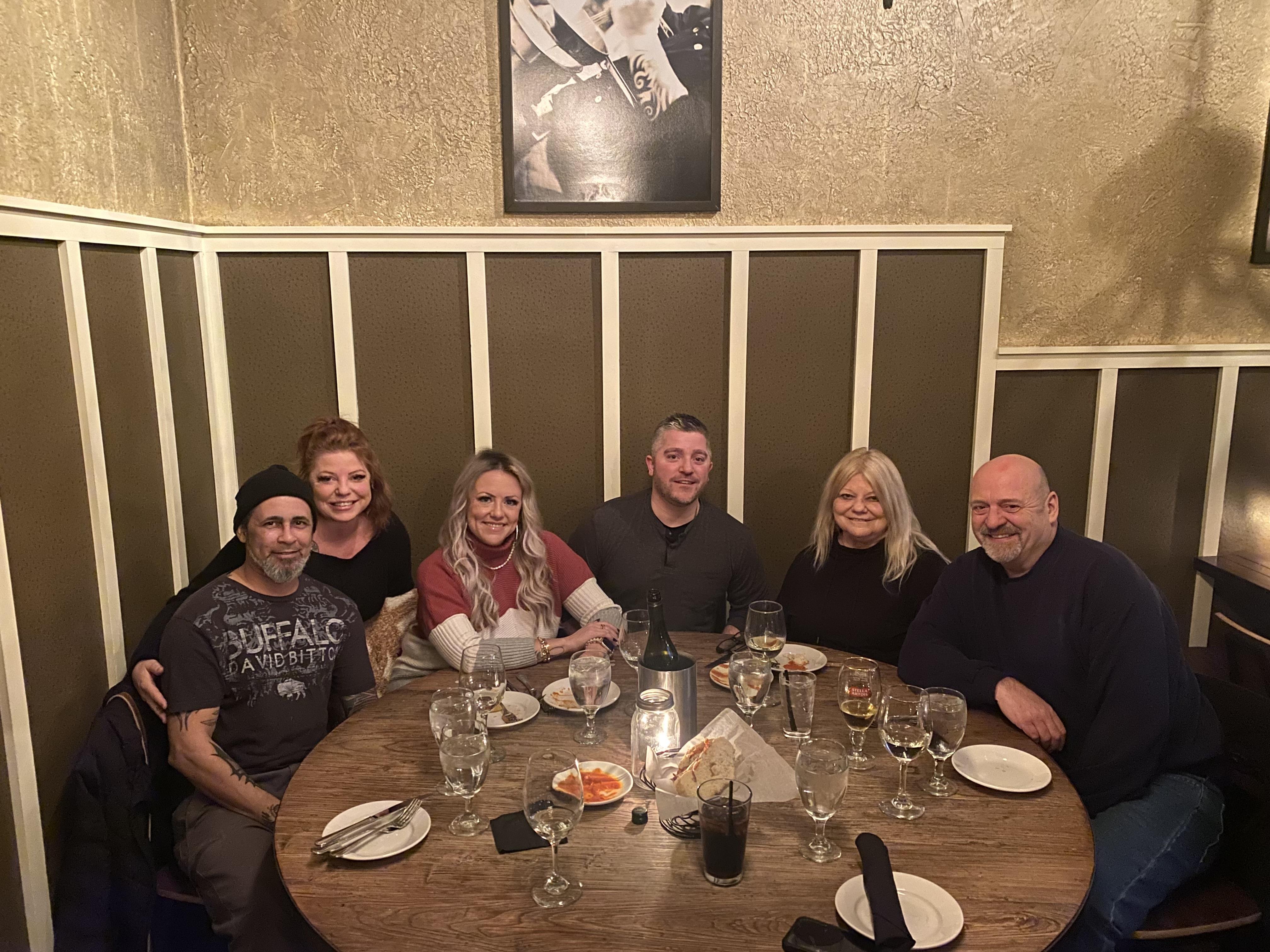 A group of people sitting around a table