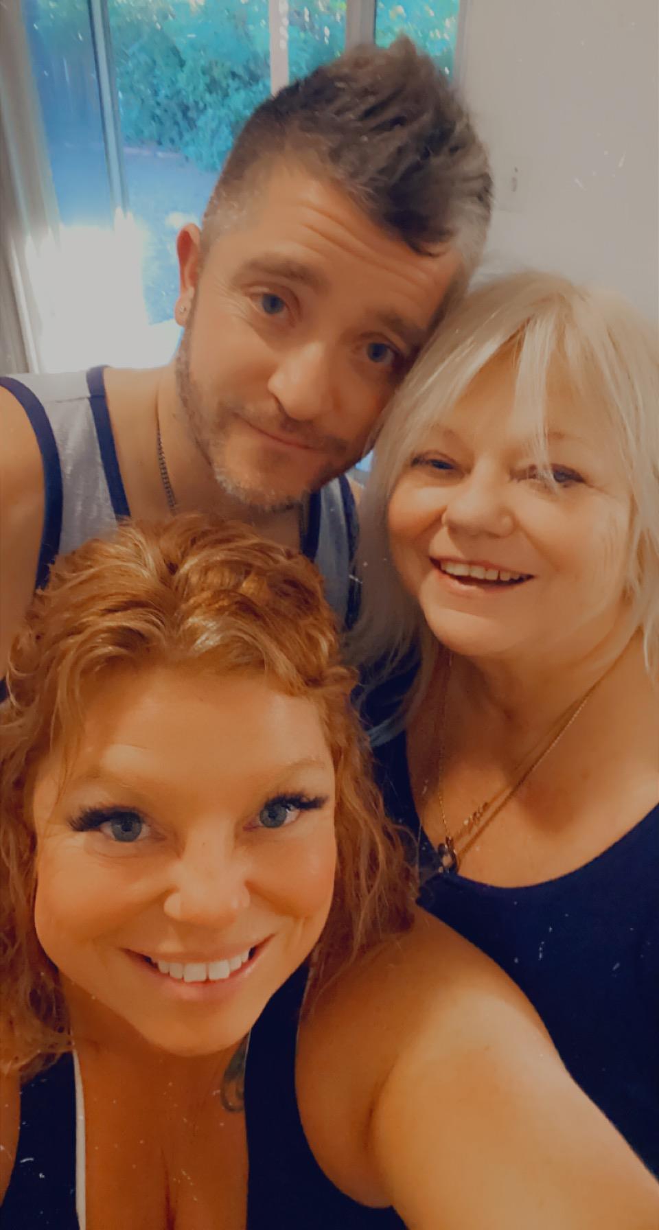 A group of people posing for a selfie