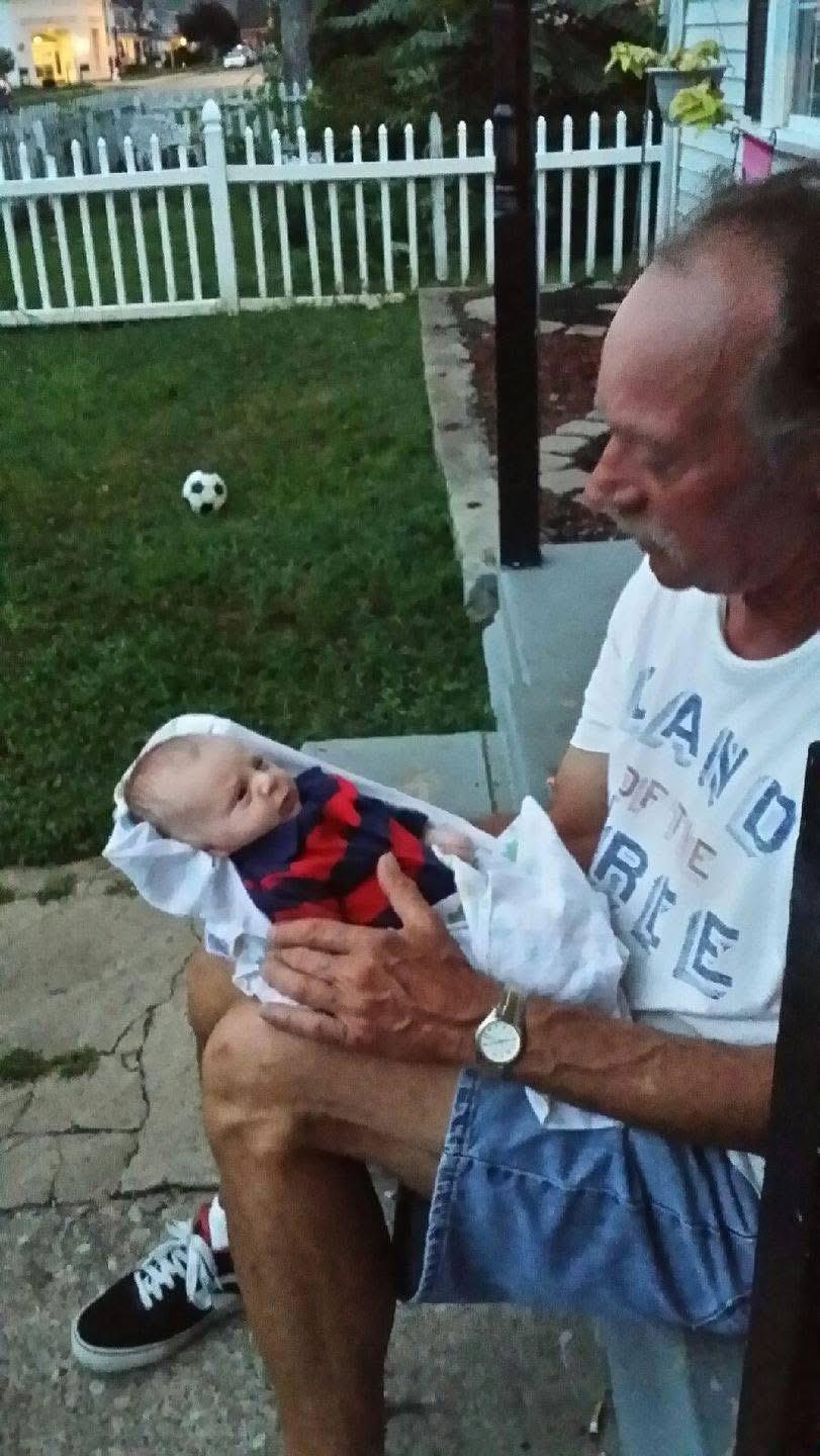 A man holding a baby in his lap