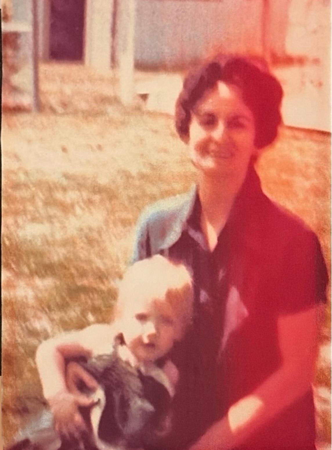 A woman holding a baby
